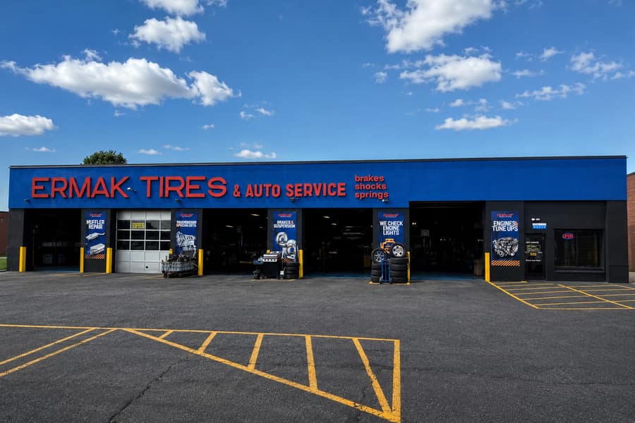 The ERMAK Tires storefront on West Cermak Road, Cicero, IL, with red signage and open bays.